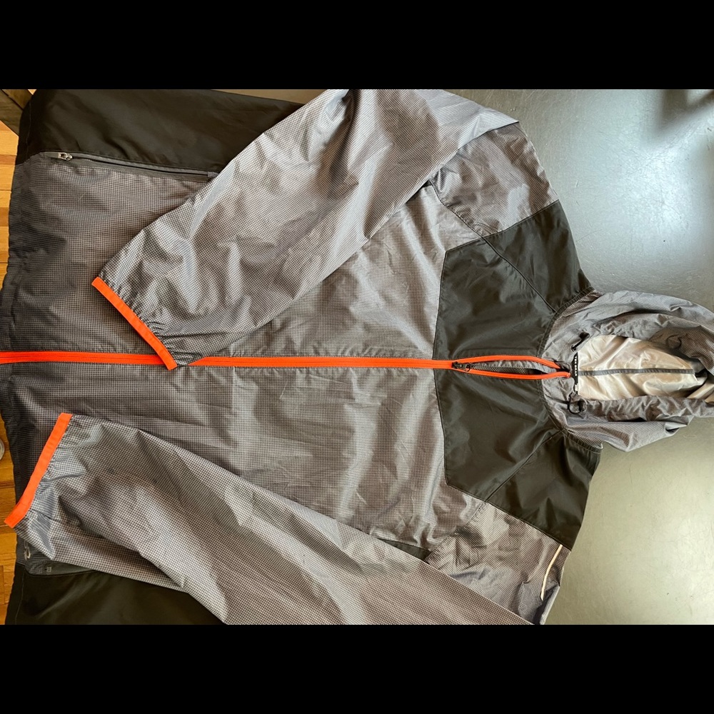 Lightweight windjacket, full zip.  Black, gray, orange and reflective trim. XL